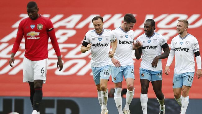 Manchester United vs West Ham United imbang 1-1 pada laga lanjutan Liga Inggris 2019/2020. (Foto: AP Photo/Clive Brunskill via cnnindonesia.com)